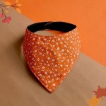 Bandana dla psa kwiatki na pomarańczowym tle